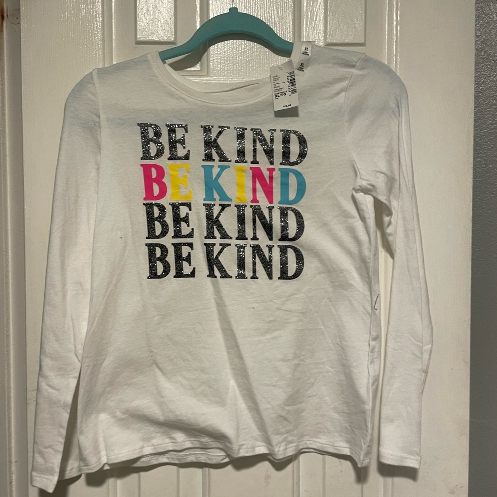 Children place white long sleeve